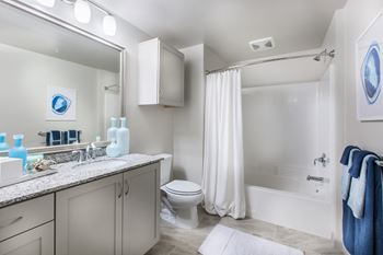 Furnished bathroom with garden style tub